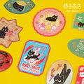 Collection of colorful stickers with black cat designs on a yellow background, featuring the Zeet Shop brand.