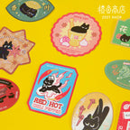Collection of colorful stickers with black cat designs on a yellow background, featuring the Zeet Shop brand.