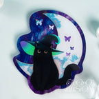 Black cat with black witch hat on a colorful crescent moon background with butterflies, brand 'Electro Illusion' visible.