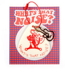 Decorative keychain with 'What's That Noise?' design on a red and blue checkered background