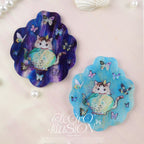 Two decorative magnets with a cat design on a textured surface, featuring the brand 'Electro Illusion'.