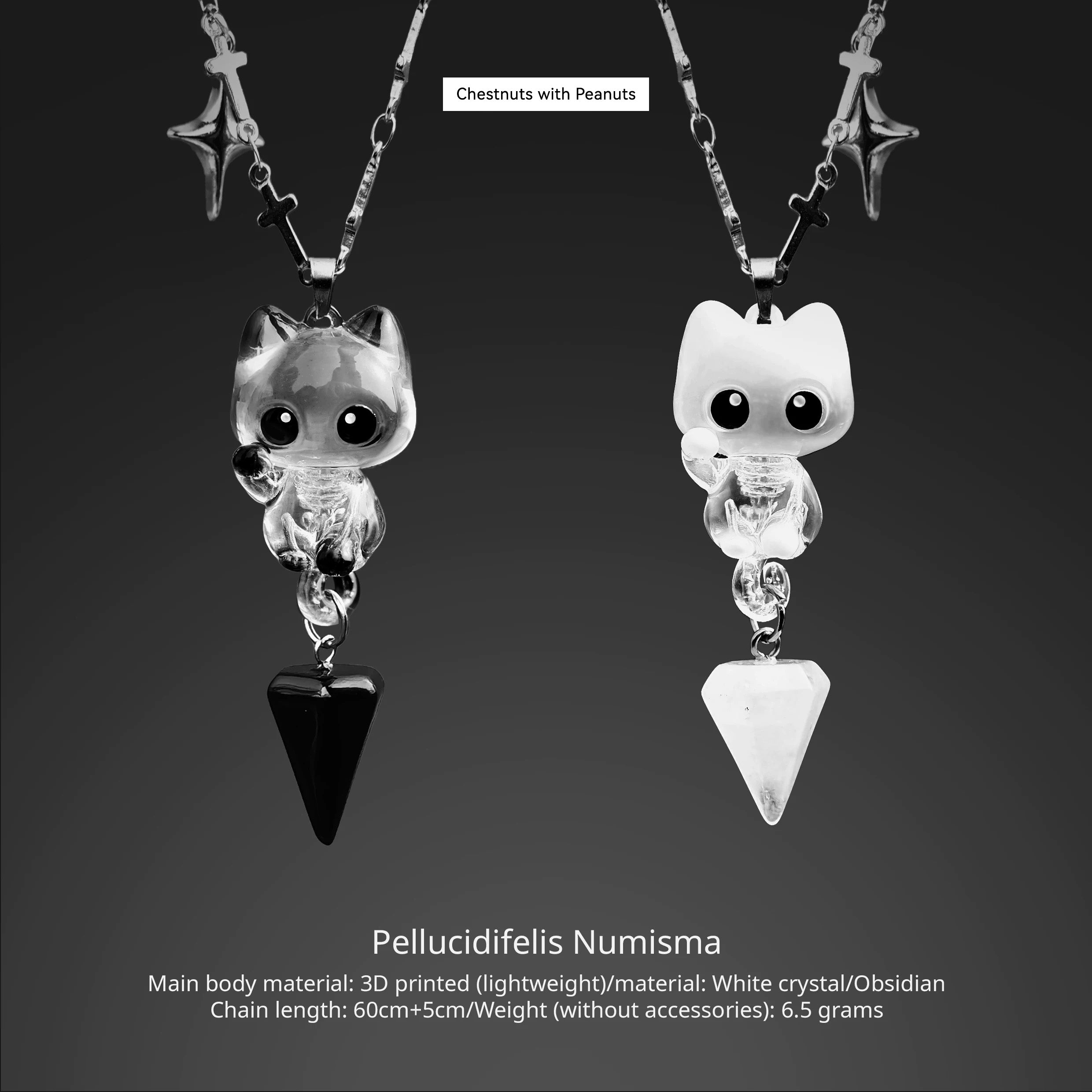 Pair of cat-shaped pendants with 3D printed design on a dark background