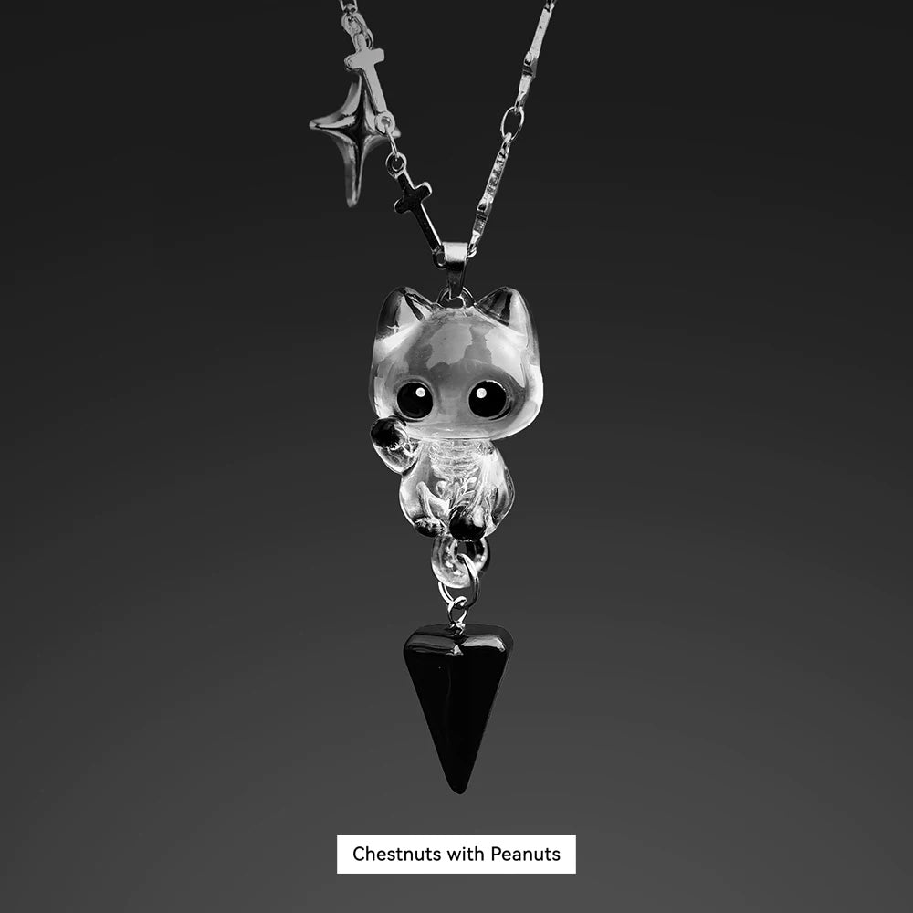 Necklace with a cat-shaped pendant and black triangle charm on a dark background