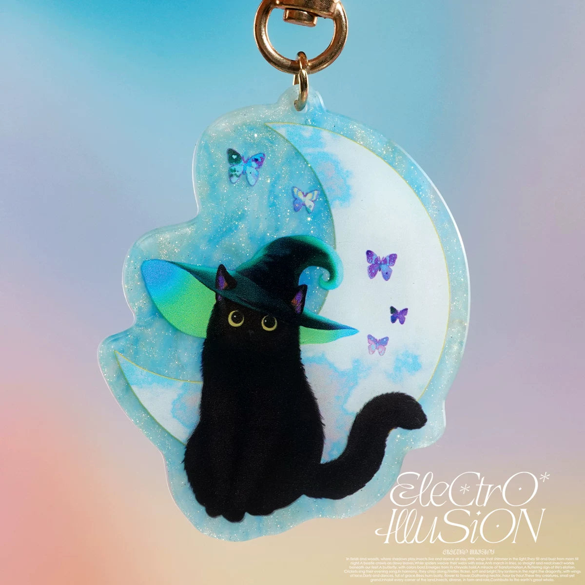 Black cat keychain with witch hat and butterflies on a colorful background