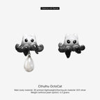 Cthulhu OctoCat earrings with pearl drop on a white background