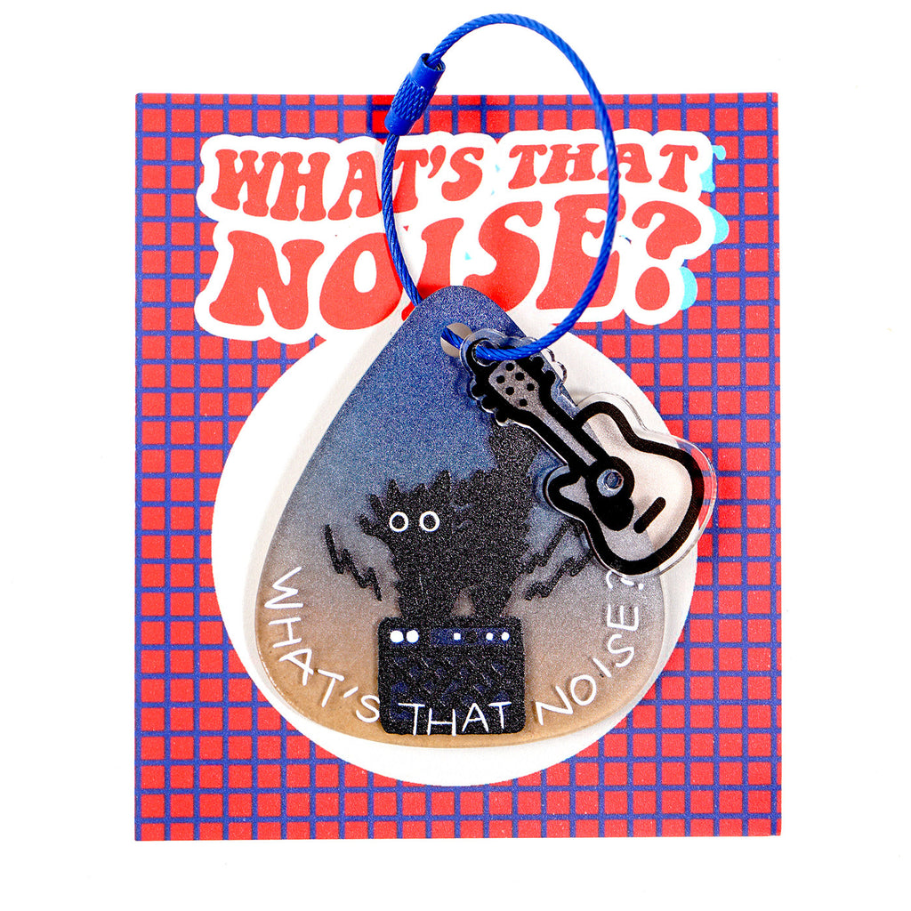 Keychain with guitar and cat design on a 'What's That Noise?' branded card.