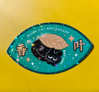 Sticker with a black cat and bay leaf design on a green background, featuring 'Black Cat Restaurant' text.