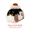 Plush toy shaped like a cow cat roll with strawberry cocoa flavor on a white background
