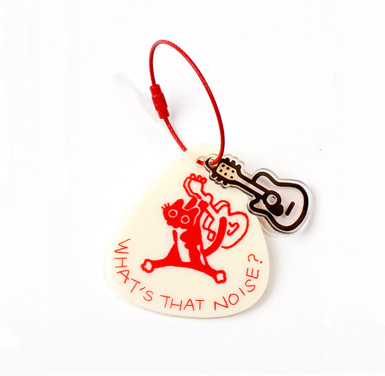 Cat keychain with red string on a white background