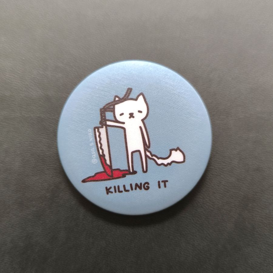 Button badge with a cat illustration and 'Killing It' text on a light blue background