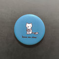 Blue button with a cat illustration and 'leave me alone' text on a dark gray background