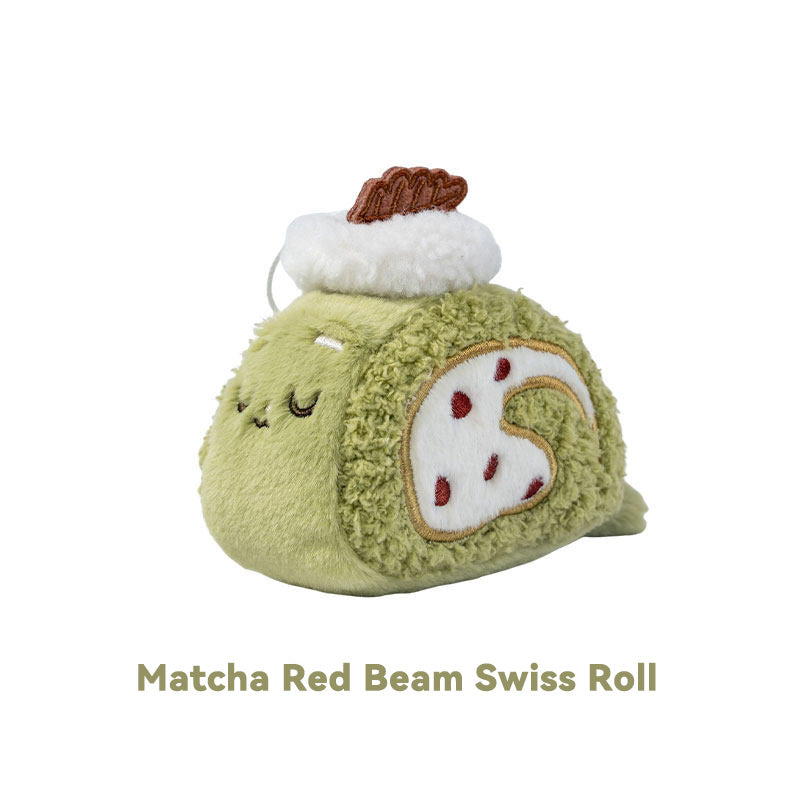 Plush toy resembling a matcha red bean Swiss roll on a white background