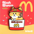 Enamel pin of Hash Brown themed pin with a cartoon cat on a red and yellow background
