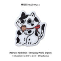 3D epoxy phone grip with cartoon cat design on a white background