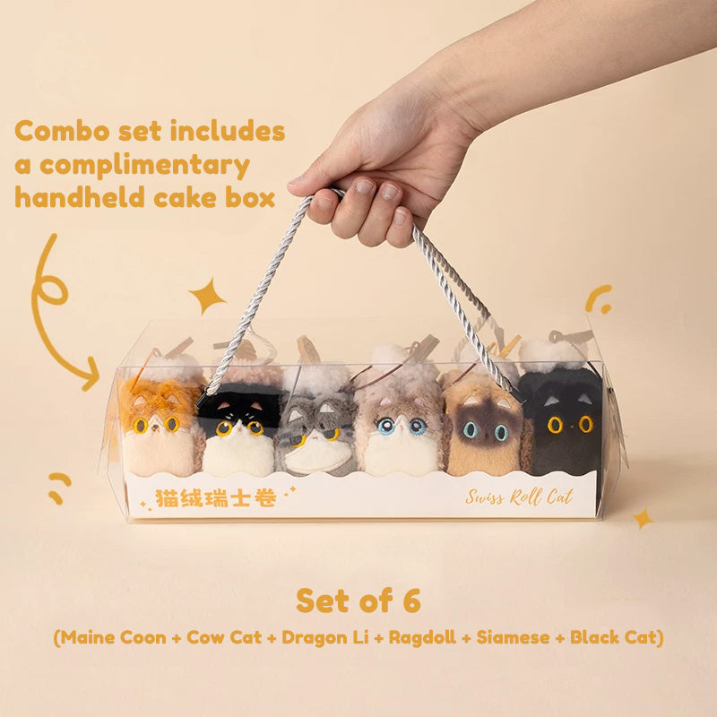 Set of 6 cat-shaped products in a cake box with a hand holding the handle, on a beige background.