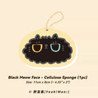 Black cat face cellulose sponge on a beige background with text
