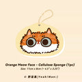 Orange Meow Face cellulose sponge with a hook on a beige background
