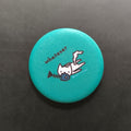 Teal button with a cartoon cat and text 'whatever' on a black background